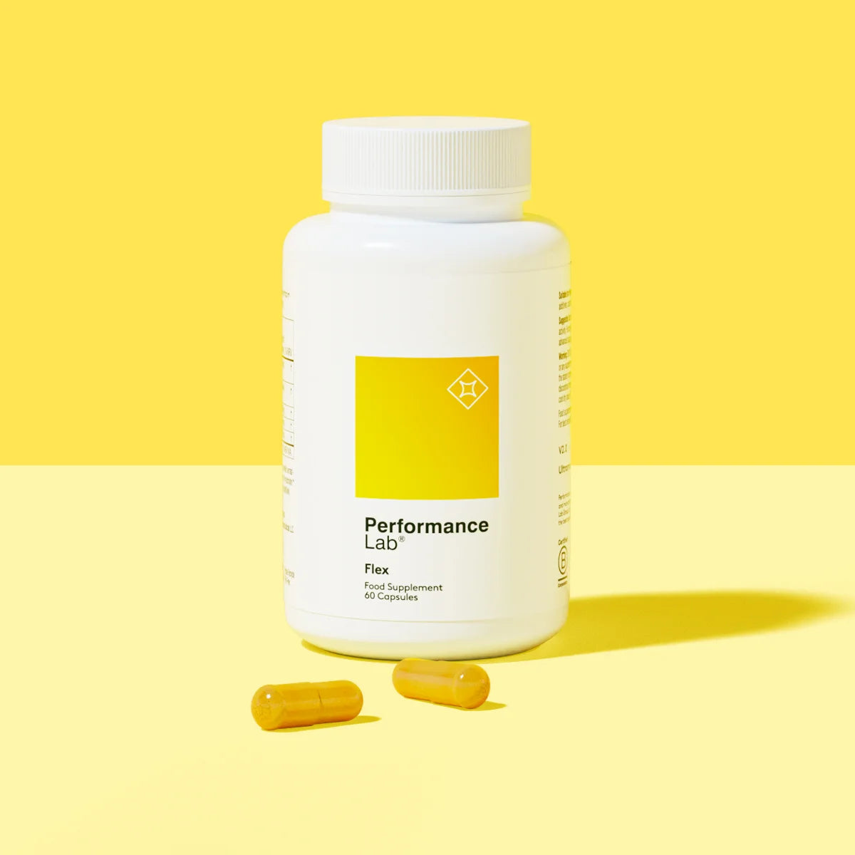 Performance Lab Flex supplement bottle with two capsules.
